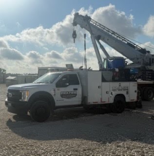 Frazier service truck working alongside a mobile crane
