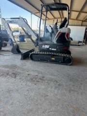 Mini excavator in for service